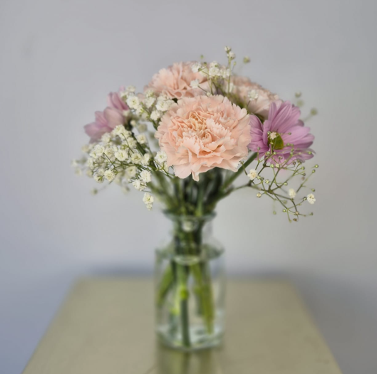 Set of 10 fresh table arrangements (vases included) £200