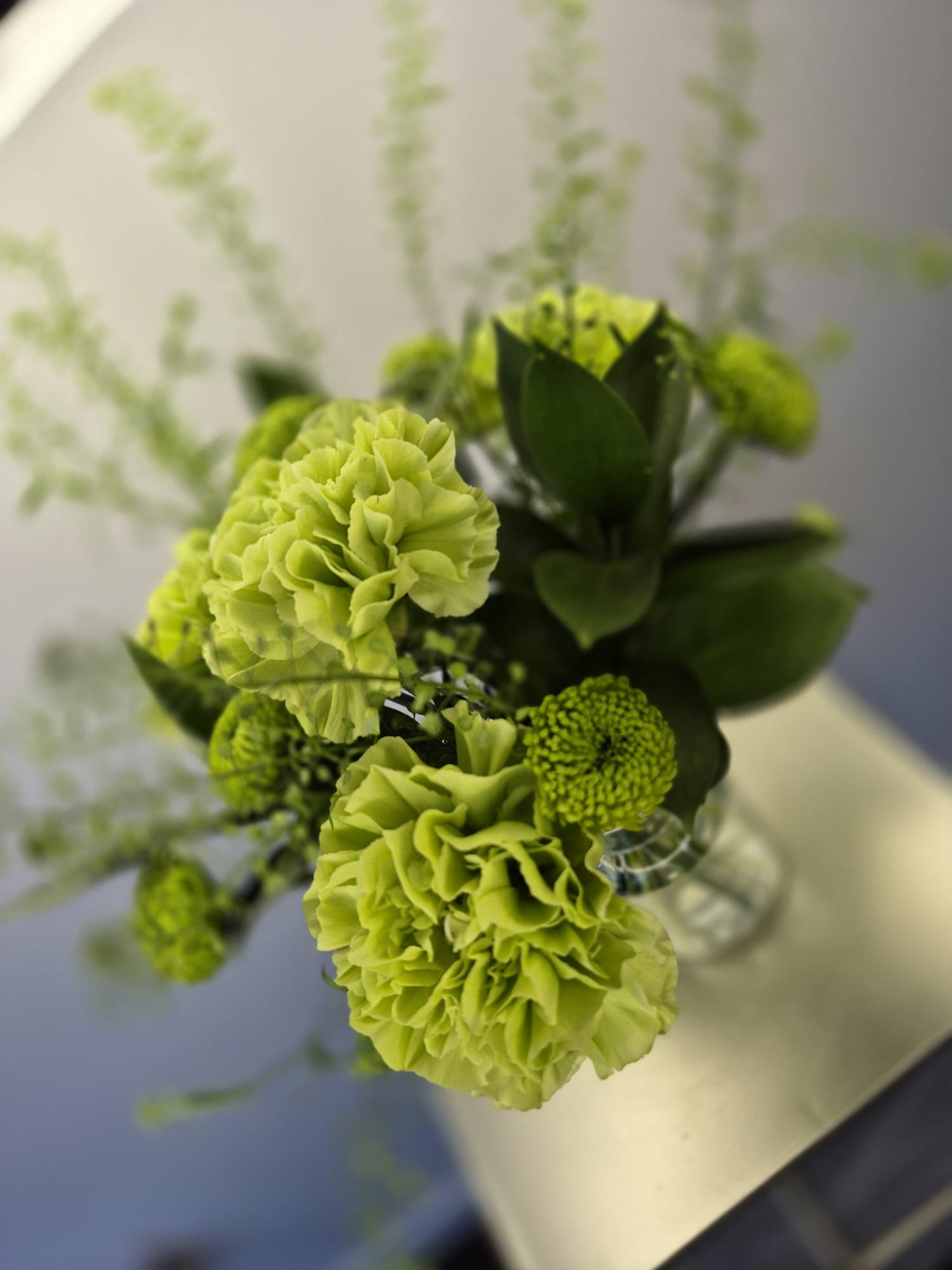 Set of 10 fresh table arrangements (vases included) £200