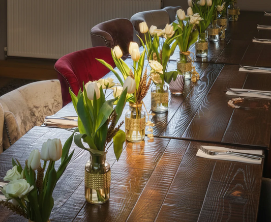 Set of 10 fresh table arrangements (vases included) £200