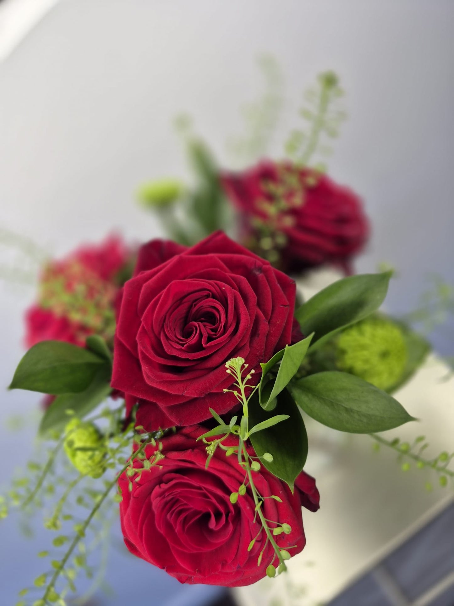 Set of 10 fresh table arrangements (vases included) £200